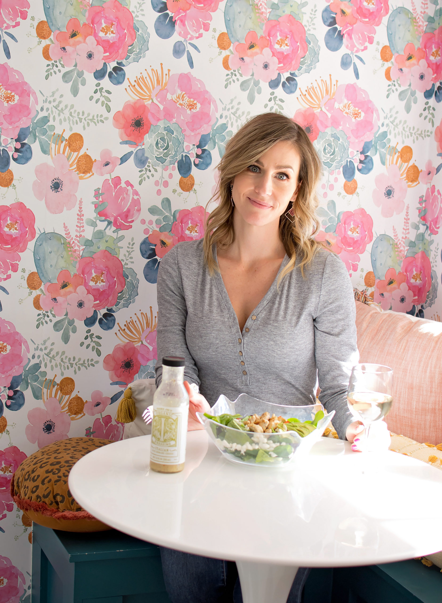 Women looking at the camera with salad in front of her