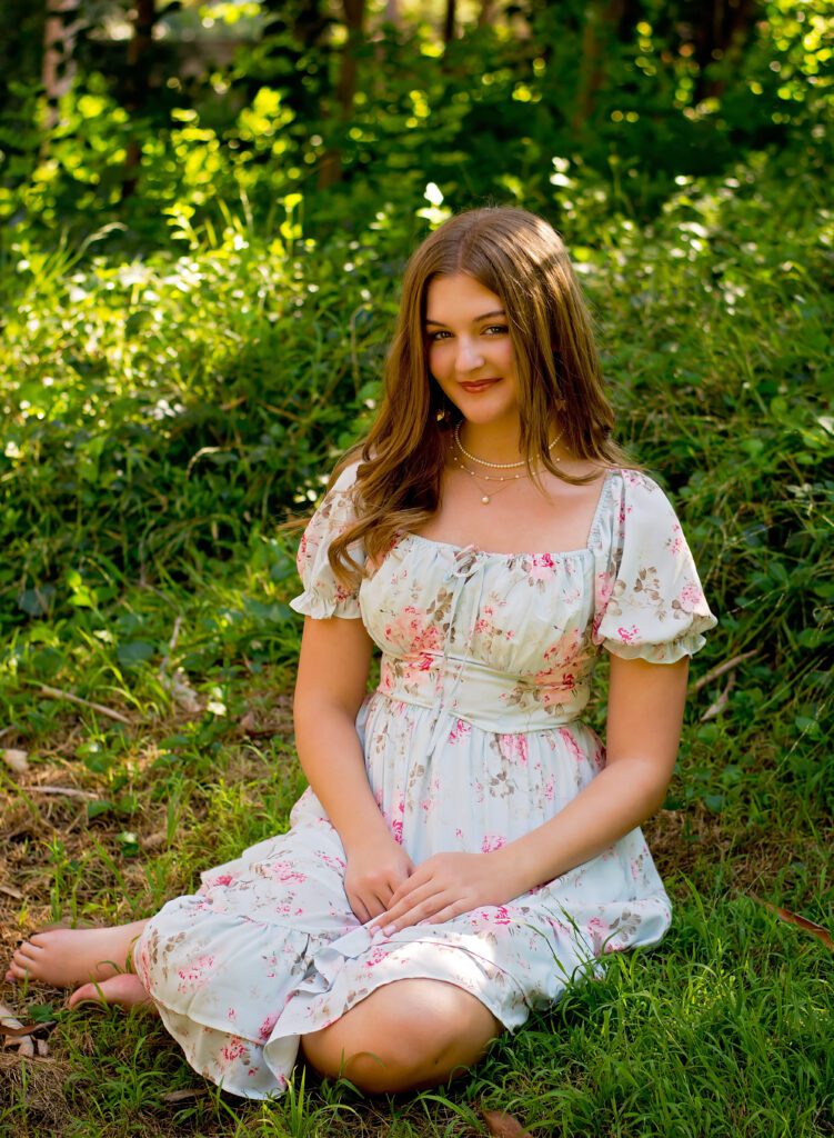 High School Senior Photoshoot at Prospect park in Redlands CA
Senior Girl sitting in the grass wearing a floral dress