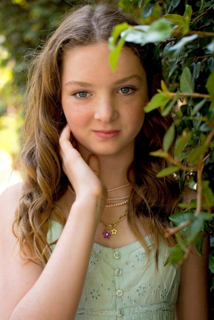 Confident tween girl in green dress and Converse during Downtown Riverside session with tween photographer Riverside CA